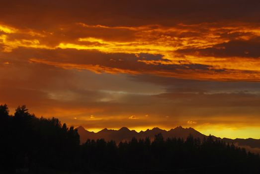 Stunning photo of Tatras mountains in Slovakia after the storm in the evening at dusk