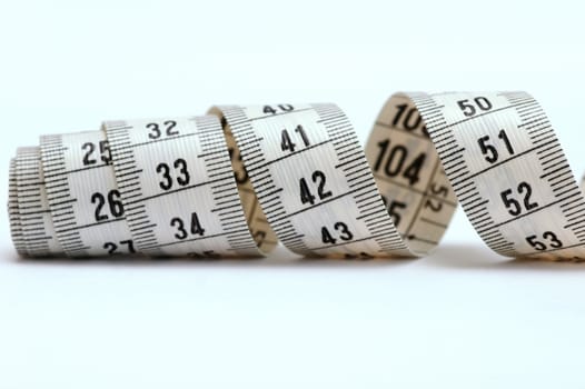 White tape measure on white background