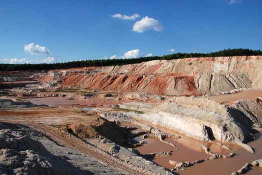 Old limestone quarry partially flooded with water