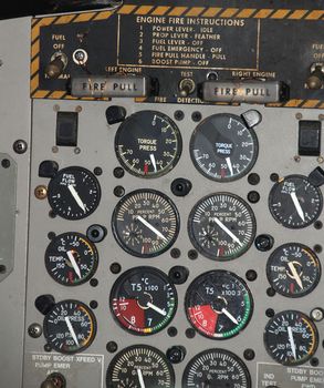 Detail of a small airplane cockpit with various indicators and buttons