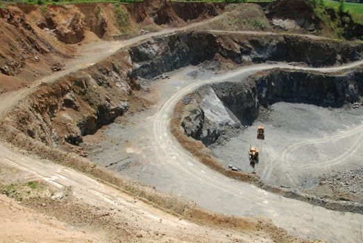 Old coal mine with machines gathering the resources