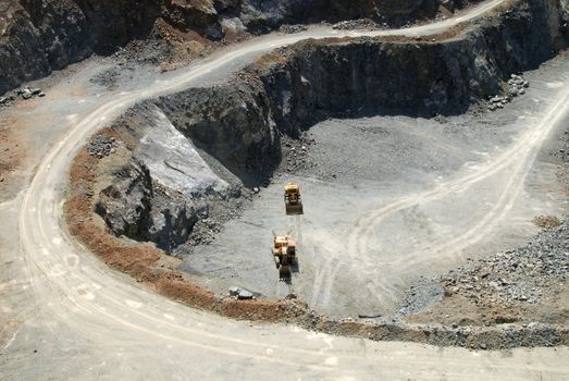 Old coal mine with machines gathering the resources