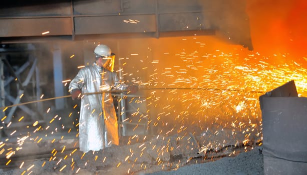 mill worker with hot steel