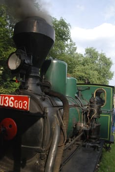 Ancient steam locomotive on a vintage railroad