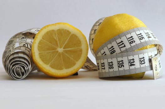 Close-up of a lemon with a measuring tape around it