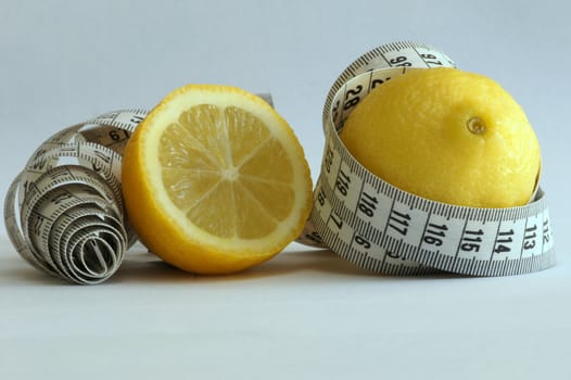 Close-up of a lemon with a measuring tape around it