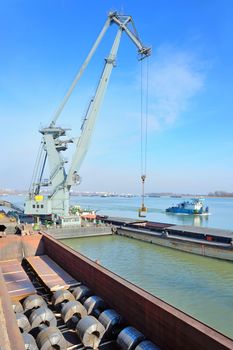 crane and steel plate loading  in harbor
