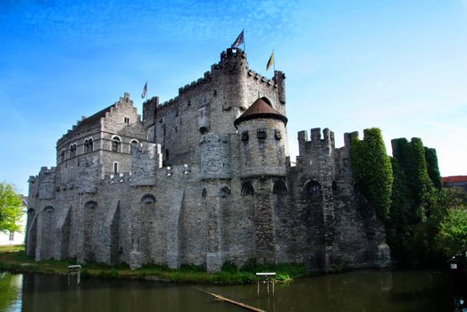 Gravensteen castle reflecting in the river. Gent, Belgium 