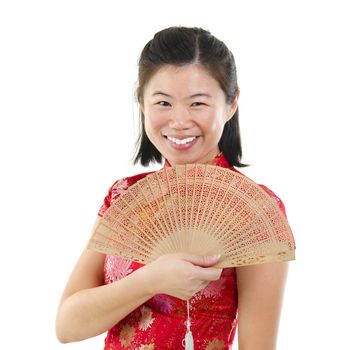 Oriental female with Chinese traditional dress Cheongsam and Chinese Fan