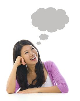 Asian girl having a thought bubble over white background