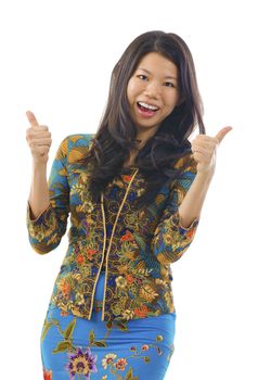 Thumbs up Asian woman in kebaya, over white background