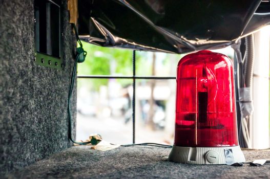 Red emergency rotating alarm deployed in a safety vehicle