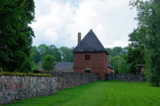 Old watch tower and wall of manor