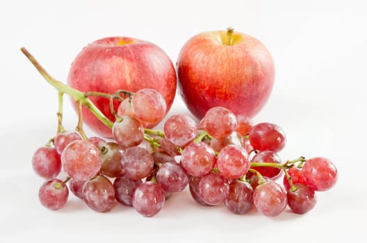 bunch of red grapes and red apple