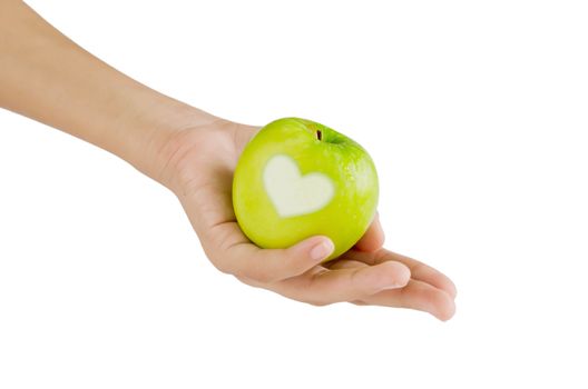 hand and green apple with  heart shape on white background