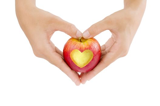 female hand and  apple with  heart shape on white background