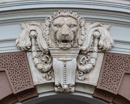 Head of lion decorated over the arch door. This photo is taken in tourist area of Chakri Maha Prasat Hall, Bangkok, Thailand.