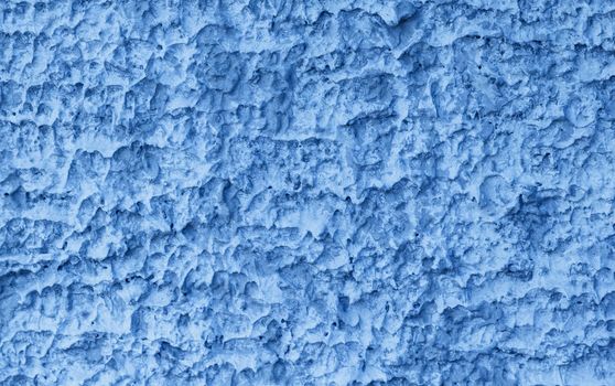 Coarse texture on concrete wall in blue color