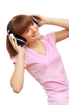 Happy smiling girl dancing and listening to music