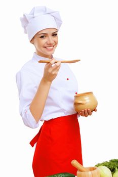 Young cook preparing food wearing a red apron