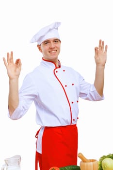 Young cook preparing food wearing a red apron