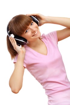 Happy smiling girl dancing and listening to music