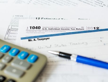 Tax form 1040 for tax year 2012 for US individual tax return with pen and check