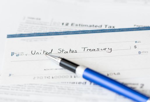 Tax form 1040 for tax year 2012 for US individual tax return with pen and check