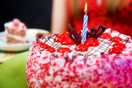 birthday cake with a lit candle. close-up