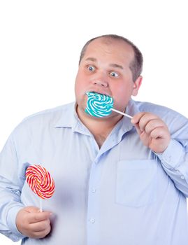 Fat Man in a Blue Shirt, Eating a Lollipop, isolated