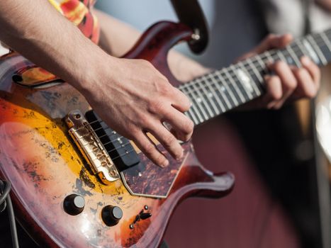 Musician or guitarist playing guitar string music instrument