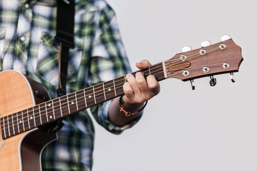 Musician or guitarist playing guitar string music instrument