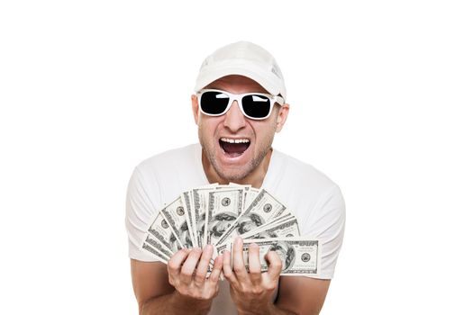 Cool smiling man in sunglasses with full hands holding dollar currency cash