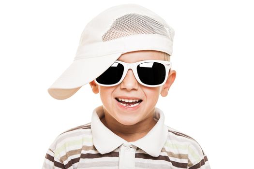 Beauty smiling child boy in sunglasses and cap white isolated