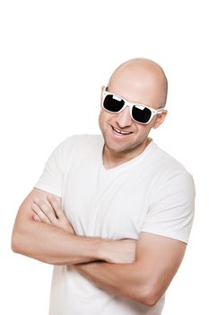 Cool smiling bald or shaved head man in sunglasses white isolated