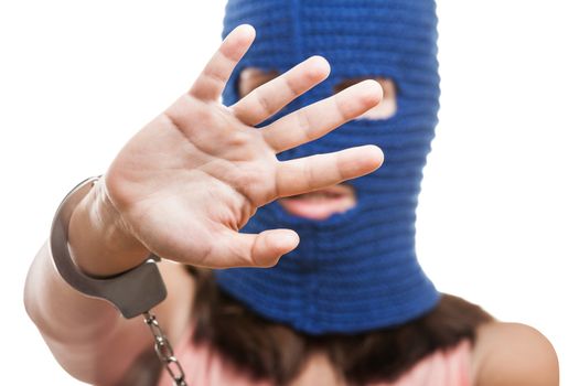 Russian protest movement concept - woman wearing balaclava or mask on head gesture shielding or showing stop sign white isolated