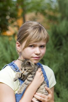 Portrait of child with kitten