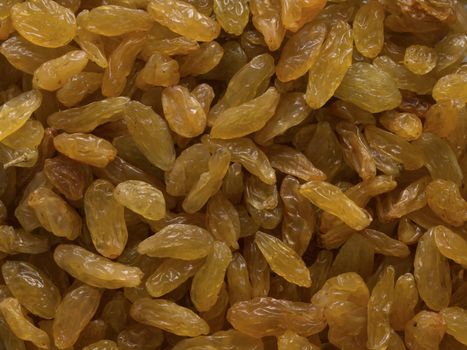 close up of golden raisins food background