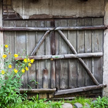 Old wooden barn door with lock