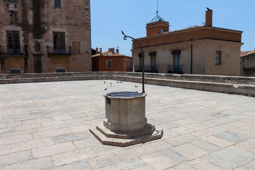 An old well, and meeting place in the old city Gerona, Spain