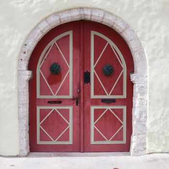 Ancient wooden door design in old city in Tallinn, Estonia