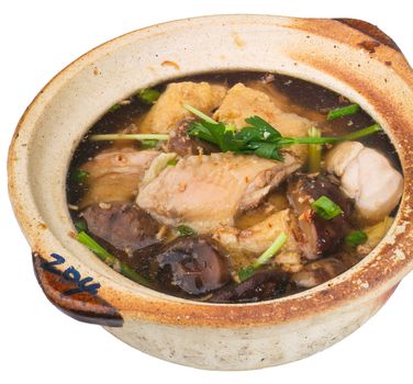 Chicken and herb soup in pot, Chinese food style.