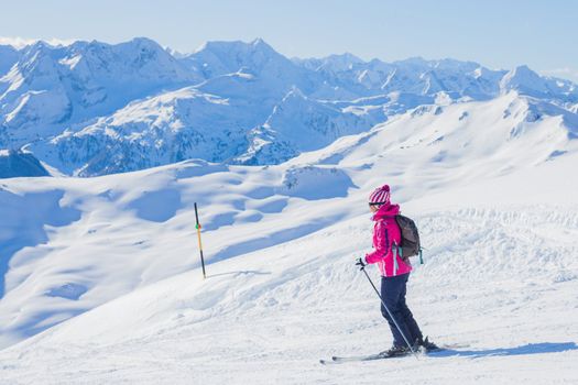 Young woman in ski outfit in the Zillertal Arena, Austria