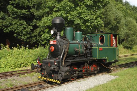 Ancient steam locomotive on a vintage railroad