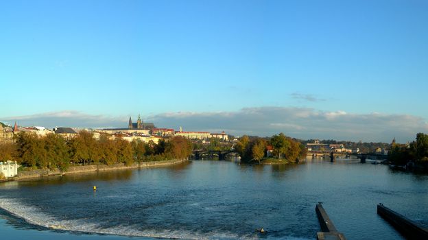 Panoramatic photo of the city of Prague with a view at Vltava River and Castle