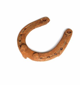 Old rusty horseshoe isolated on the white background