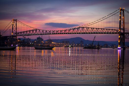 The Hercilio Luz Bridge, in Florianopolis, Brazil, with an amazing sunset.