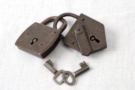 Two antique padlocks with keys