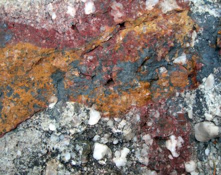 Stone texture with colorful streaks