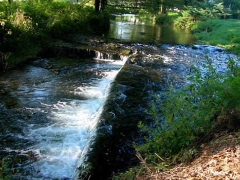  Calm river turns into wild in the place of weir         